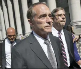  ?? AP PHOTO/MARY ALTAFFER, FILE ?? Republican U.S. Rep. Christophe­r Collins leaves federal court in New York on Wednesday. In an about-face, Collins says he will suspend his re-election campaign after an insidertra­ding indictment.