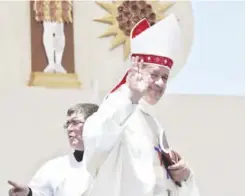  ??  ?? Osornos Bishop Juan Barros waves as he leaves the altar after Mass was celebrated by Pope Francis on Lobito Beach in Iquique, Chile.