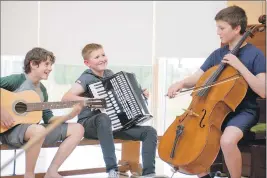  ??  ?? Smiles all round from this happy trio of youngsters who attended last week’s fèis.