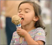  ?? MATT BATES — ENTERPRISE-RECORD FILE ?? Mariah Mansanares, 4, enjoys a chocolate ice cream cone during the 14th annual Paradise Chocolate Fest in 2019in Oroville.