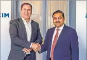  ?? PTI ?? Adani Group chairman Gautam Adani with Holcim chief executive officer Jan Jenisch.