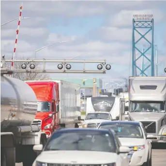  ?? DAX MELMER ?? The Ambassador Bridge normally handles up to 8,000 trucks per day, but in February all cross-border haulage ground to a halt. It was only after injunction­s were obtained that the blockade was removed.