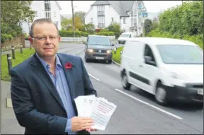  ?? Picture: Martin Apps FM4090121 ?? Parish council chairman John Govett with a petition demanding a relief road in Leeds village