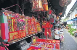  ??  ?? Costumes for Chinese opera performers as well as utensils from yesteryear are on display in Ban Kao Lao Rueng Museum.