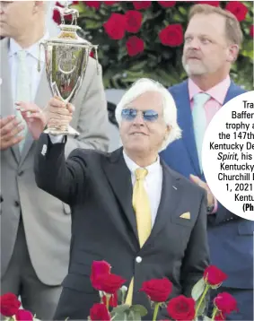  ?? (Photo: AFP) ?? Trainer Bob Baffert raises the trophy after winning the 147th running of the Kentucky Derby with Medina Spirit, his seventh career Kentucky Derby win, at Churchill Downs on May 1, 2021 in Louisville, Kentucky, USA.