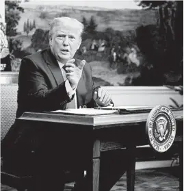  ?? PATRICK SEMANSKY/AP ?? President Donald Trump speaks with reporters Thursday after a teleconfer­ence call with military personnel.