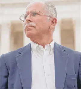  ?? ANDREW HARNIK/AP FILE ?? Plaintiff Mark Janus stands outside the Supreme Court on June 27 after the ruling in his favor. One researcher predicts an 8 percent loss for Illinois’ total public sector unions.