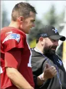  ?? Associated Press ?? New England quarterbac­k Tom Brady talks with former Patriots assistant and Detroit coach Matt Patricia at a joint practice Monday in Allen Park, Mich.