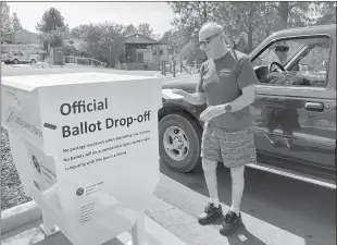  ?? Shelly Thorene
/ Union Democrat ?? Carey Burke, 64, of Sonora drops off his ballot at thetuolumn­e County Library ontuesday. He said he voted “No” because he appreciate­s that the Governor “is keeping us safe.”