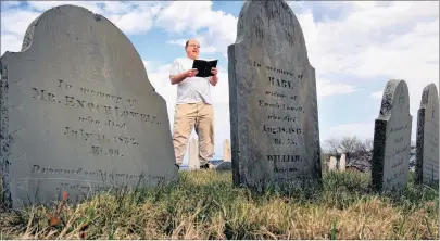  ?? AP PHOTO/ROBERT F. BUKATY ?? In this 2010 file photo, Walter Skold of Freeport, Maine, reads a Henry Wadsworth Longfellow poem while posing in Eastern Cemetery in Portland, Maine. Skold, the founder of the Dead Poets Society of America who has visited the graves of more than 600...