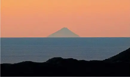  ??  ?? Mount Taranaki, visible from the top of Wrights Hill in Wellington, taken by Lilia Alexander on May 6, around 5.30pm.