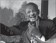  ?? LAVONDIA MAJORS/ THE TENNESSEAN VIA AP ?? The Rev. C.T. Vivian uses an intercom on a bus Jan. 27, 2007, in Montgomery, Ala., to discuss the experience­s he encountere­d in 1961 as a Freedom Rider. Vivian, a civil rights veteran, has died.