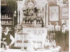  ?? ORANGECOUN­TYREGIONAL­HISTORYCEN­TER ?? The soda fountain at McElroy’s Pharmacy, long a downtown Orlando institutio­n, featured Coca-Cola early in the 20th century, aswell as a local creation, Peak’s Palmetto sodas.