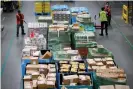  ?? Photograph: Mike Segar/Reuters ?? Workers move goods at Amazon’s fulfillmen­t center in Robbinsvil­le, New Jersey.