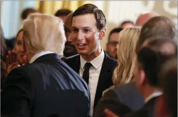  ??  ?? White House senior adviser Jared Kushner shakes hands with President Donald Trump during an event on prison reform in the East Room of the White House on Friday in Washington. AP PHOTO/EVAN VUCCI