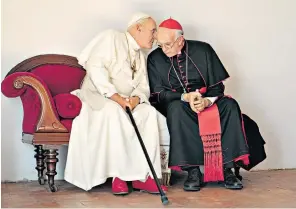  ??  ?? Holy communion: Anthony Hopkins as Benedict XVI and Jonathan Pryce as the future Pope Francis