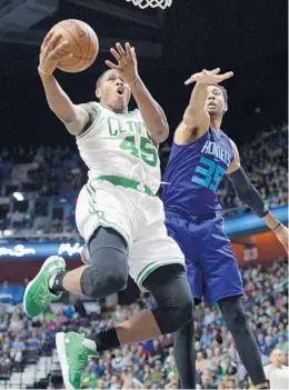  ?? JESSICA HILL/ASSOCIATED PRESS ?? Marcus Georges-Hunt, left, shown during a Celtics preseason game in October, averaged 15.8 points per game this season for the Maine Red Claws of the NBA D-League.