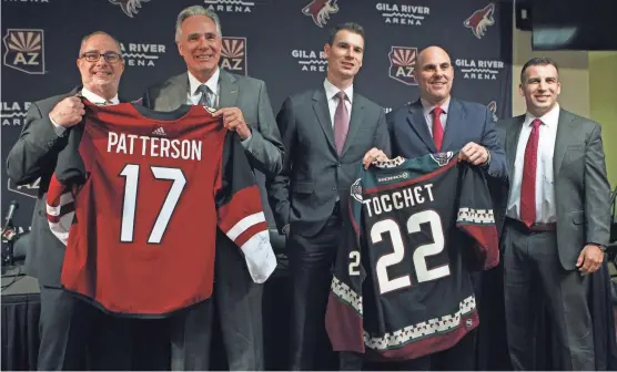  ?? SAM CARAVANA/ AZCENTRAL SPORTS ?? (From left) Coyotes owner Andrew Barroway, new CEO Steve Patterson, GM John Chayka, new head coach Rick Tocchet and Ahron Cohen pose at Thursday’s news conference at Gila River Arena in Glendale.