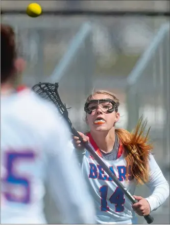  ?? TIM MARTIN/THE DAY ?? Coast Guard Academy’s Daria McKenna receives a pass behind the Springfiel­d College goal during Saturday’s 17-6 loss to the Pride in New London. McKenna, a senior from Fitch High School, is on the cusp of scoring 100 career points and is a major part of...