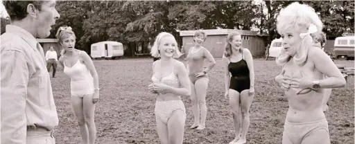  ??  ?? Top billing: Barbara’s character, also called Babs, loses her bra during a fitness class in Carry On Camping in 1969