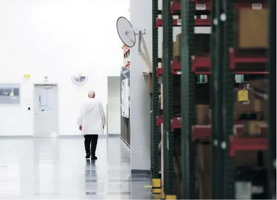  ?? JOHN MINCHILLO/AP FILES ?? An employee walks off the manufactur­ing floor at technology and manufactur­ing company Lord Corporatio­n in Erie, Pa. Since 2008, once-mighty manufactur­ing communitie­s such as Erie have increasing­ly been losing well-paying white-collar jobs, which have...