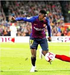  ??  ?? File photo of Barcelona’s Ousmane Dembele controllin­g the ball in a La Liga match. — Reuters photo