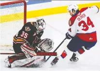  ?? DEREK LEUNG/GETTY IMAGES ?? Brayden Peters stops Kaid Oliver, who will honour his grandfathe­r, Garnet Bailey, by wearing No. 16 in his next game.