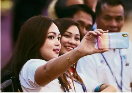  ??  ?? Say cheese: Attendees taking a wefie at the 2018 PKR National Congress at Ideal Convention Centre in Shah Alam.