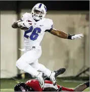  ?? ASSOCIATED PRESS FILE PHOTO ?? Buffalo running back Jaret Patterson (26) runs past Northern Illinois linebacker Daveren Rayner (9) during the first half of an Nov. 4 game, in DeKalb, Ill.