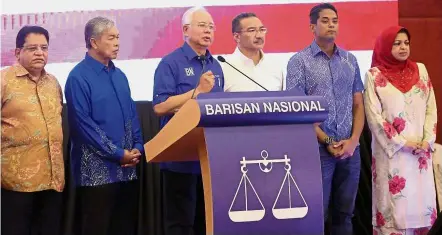  ??  ?? Solemn speech: Najib speaking during the press conference at PWTC. With him are (from left) Tengku Adnan, Dr Ahmad Zahid, Hishammudd­in, Khairy and Shahrizat.