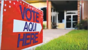  ?? John Moore Getty Images ?? sign stands outside a polling center in Austin, Texas.