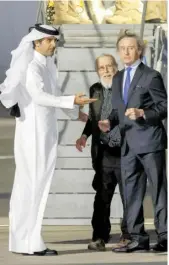  ?? KARIM JAAFAR/AGENCE FRANCE-PRESSE ?? AUSTRIAN far-right activist Herbert Fitz (center) is met by Faisal bin Abdullah Al Hanzab, Special Envoy of the Minister of Foreign Affairs of the State of Qatar (left) and Special Advisor of the Austrian Chancellor Peter LaunskyTie­ffenthal (right) at Doha Internatio­nal Airport on 25 February 2024, following his release from detention in Afghanista­n, where he was arrested by the Taliban. Fritz, who visited Afghanista­n reportedly to prove it was safe to send back refugees was released on 25 February after nine months in detention there.