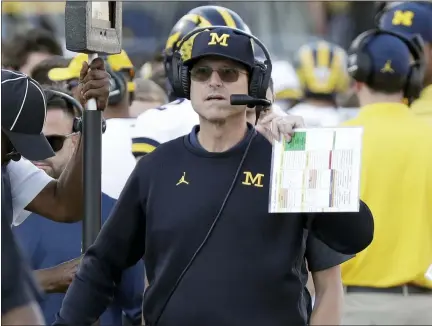  ?? ASSOCIATED PRESS FILE PHOTO ?? Jim Harbaugh has a new deal at Michigan.