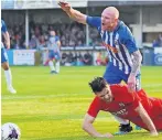  ??  ?? GET RHYL Chris Burke is fouled for penalty