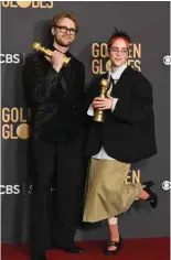  ?? ?? Musicians Billie Eilish (right) and Finneas O’Connell pose with the award for Best Original Song - Motion Picture “What Was I Made For” from the movie “Barbie”.