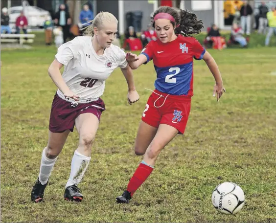  ?? Photos by Lori Van Buren / Times Union ?? Greenville’s Morgan Whitbeck, left, vies for the ball with Maple Hill’s Isabella Thomas during their game Wednesday in Schodack.