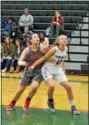  ?? PAUL DICICCO — THE NEWS-HERALD ?? Lake Catholic’s Caitilin Kotek, right, boxes out Mentor’s Allyson Swider on a free throw Dec. 20.