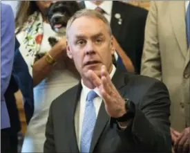  ?? MOLLY RILEY — THE ASSOCIATED PRESS ?? Interior Secretary Ryan Zinke speaks at the Interior Department in Washington on Wednesday after signing an order lifting a moratorium on new coal leases on federal lands and a related order on coal royalties.