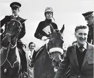  ?? ?? KING OF AINTREE Trainer Ginger Mccain leads in Red Rum after one of his Grand National successes