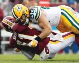  ?? AP ?? Packers linebacker Clay Matthews was hit with another controvers­ial roughingth­e-passer penalty on this would-be sack of Redskins QB Alex Smith.