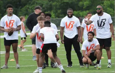  ?? Scott Herpst ?? BELL GIVES BACK: Current Cincinnati Bengals standout and former Ridgeland Panther Vonn Bell hosted the Vonn Bell Academy Skills Camp on Saturday, June 25 at Bowers and Painter Field on the campus of Ridgeland. Bell, along with a few of his friends, were on hand to instruct nearly 100 elementary school, middle school and high school football players through a series of different drills and games, while the camp also included a clinic in the school’s auditorium to give advice to parents on ACT testing, FAFSA, recruiting and the NCAA clearing house. This was the third year for the camp.