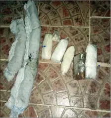  ??  ?? Picture showing an assortment of drugs seized in a pouch tied to a cat as it tried to enter a prison in Colon, Panama. — AFP photos