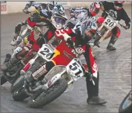  ?? NEWS SENTINEL FILE ?? Shawn Raggio (51z) leads most of the pack of racers into the number four corner during the Night Before the Mile Short Track race in a recent year.