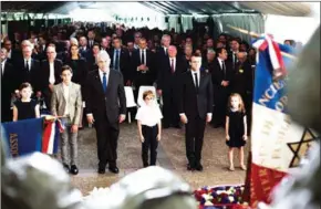  ?? KAMIL ZIHNIOGLU/AFP ?? Israeli Prime Minister Benjamin Netanyahu (third left) and French President Emmanuel Macron (second right) pay their respects during a ceremony commemorat­ing the 75th anniversar­y of the Vel d’Hiv roundup in Paris yesterday.