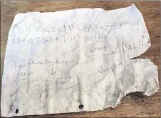  ?? ERIN POTTIE/SALTWIRE NETWORK ?? This message sent adrift in the Great Bras d’Or channel 18 years ago reads: “Dear you, I am glad you have found this bottle.”