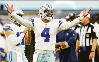  ?? Ashley Landis / Associated Press ?? Dallas Cowboys quarterbac­k Dak Prescott gestures during warm ups before a preseason game against the Los Angeles Chargers Aug. 20 in Inglewood, Calif.