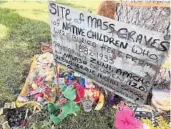  ?? SUSAN MONTOYA BRYAN/AP 2021 ?? A makeshift memorial for dozens of Indigenous children who died while attending a boarding school is displayed in Albuquerqu­e, N.M.