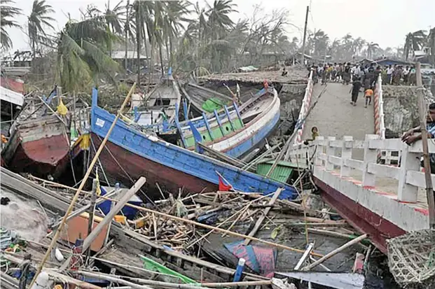  ?? Photo: 9News ?? Broken boats are piled up next to a broken bridge in Sittwe, in Myanmar’s Rakhine state after Cyclone Mocha made landfall.