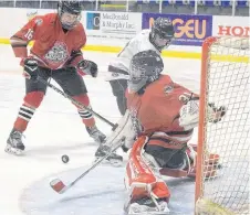  ?? KEVIN ADSHADE/THE NEWS ?? Pictou County Bantam A Crushers goalie Jacob MacLeod makes a save at the memorial tournament on Feb. 2.