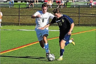  ?? AUSTIN HERTZOG - DIGITAL FIRST MEDIA ?? Spring-Ford’s Ronnie Minges maintains possession as Methacton’s Trevor Rambo defends Wednesday.